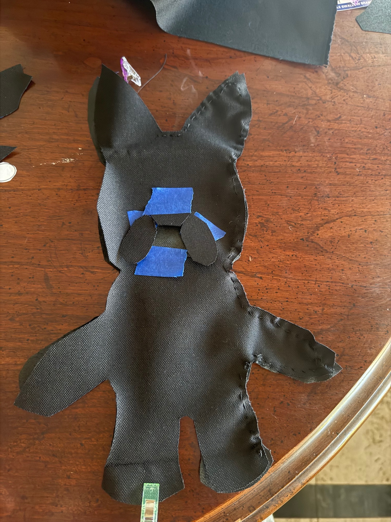 Cut panels with face pieces placed before stitching.