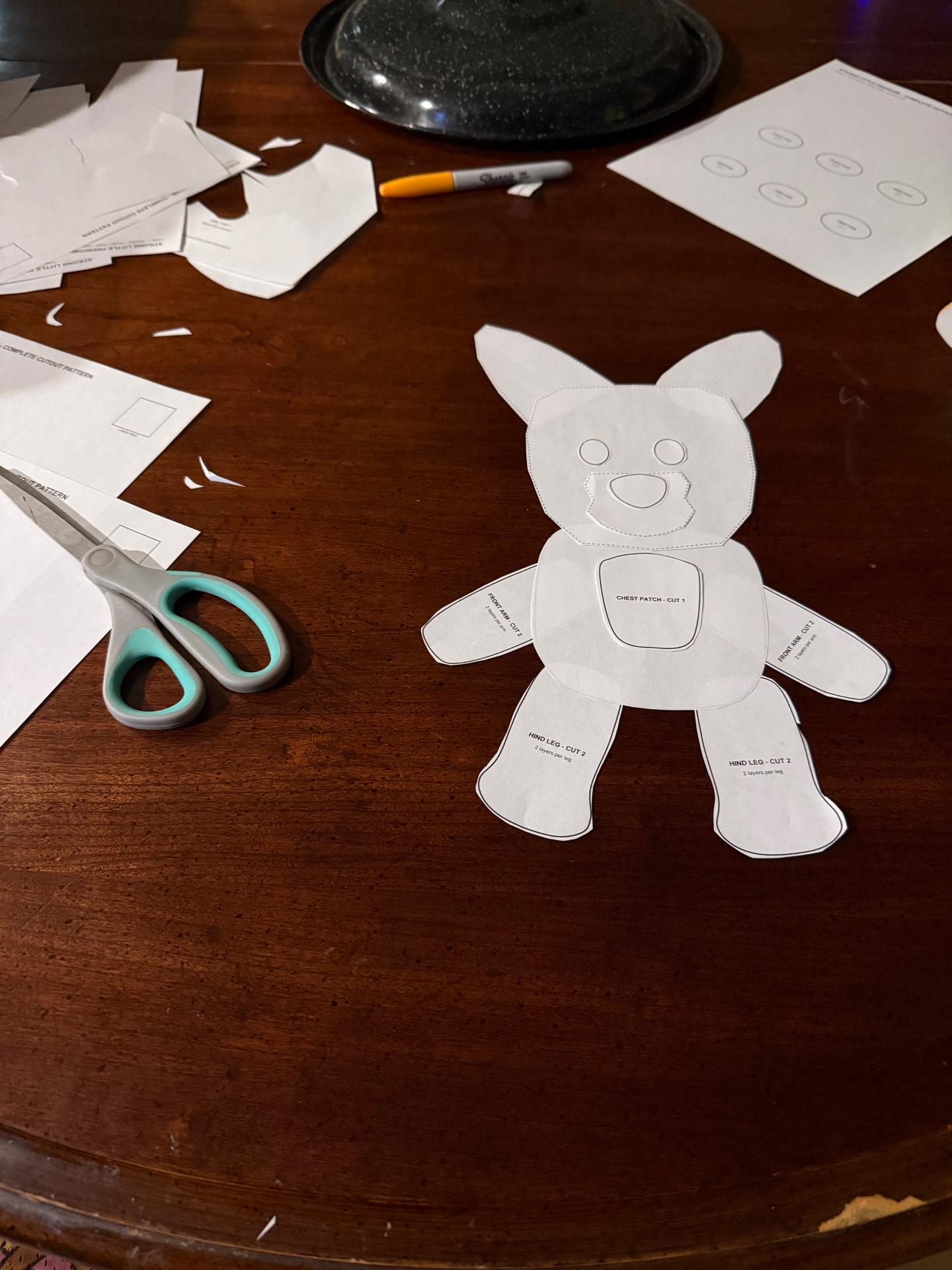 Hand-cut paper pattern pieces for the Frenchie shape.